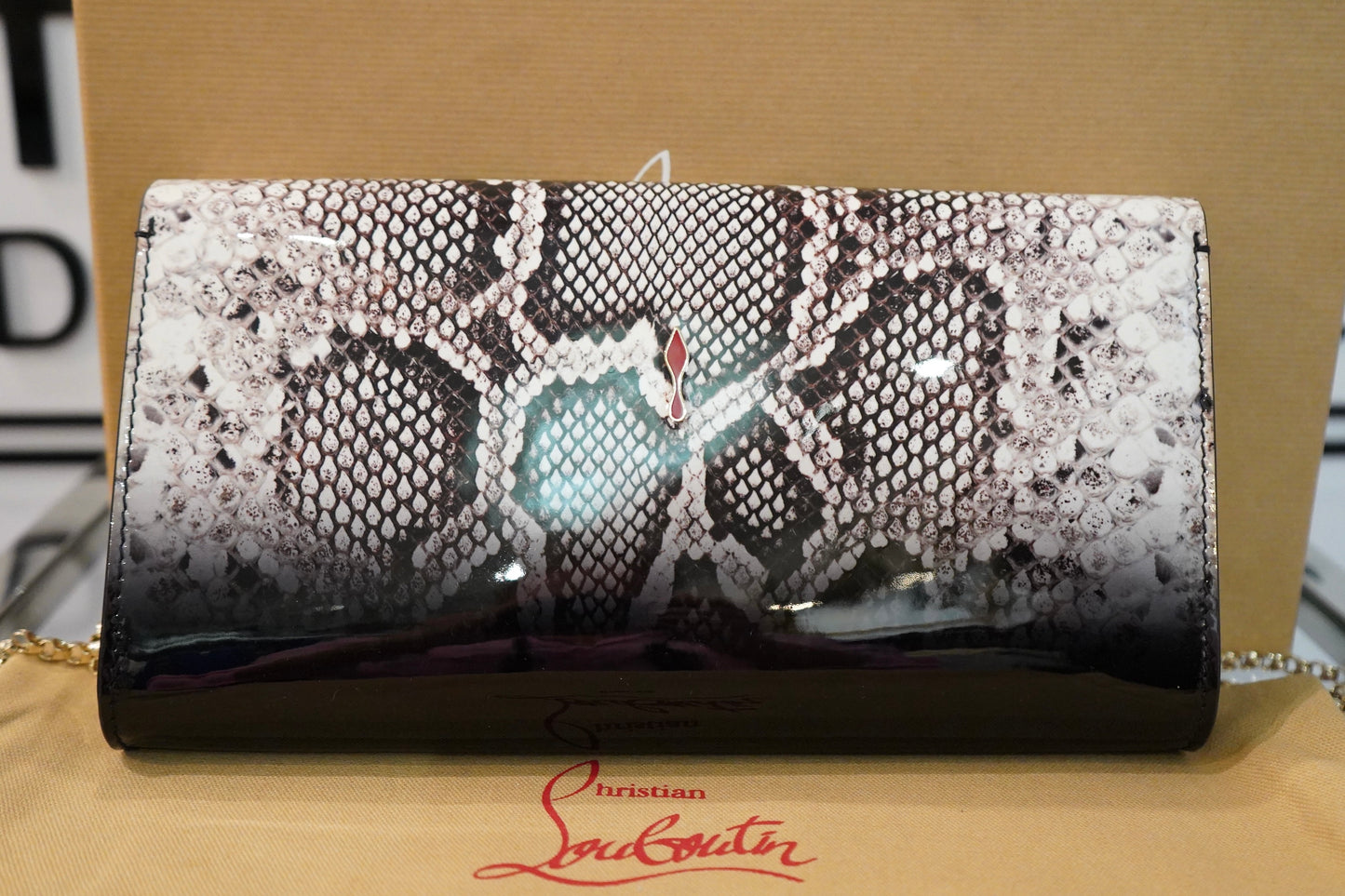 Preowned Louboutin Vero Dodat Patent Leather Clutch. UNUSED