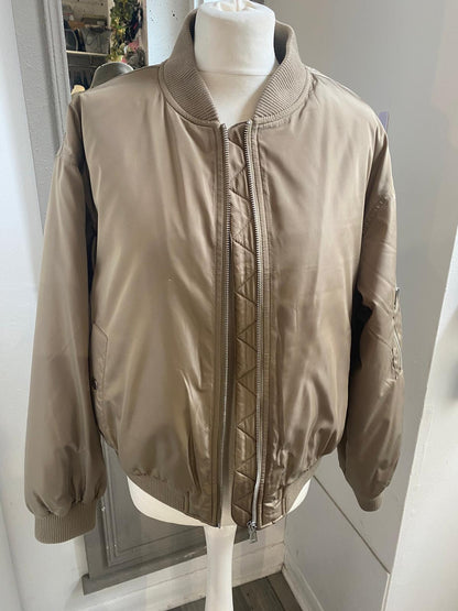 front of preowned Hush Stone Colour Bomber Jacket
