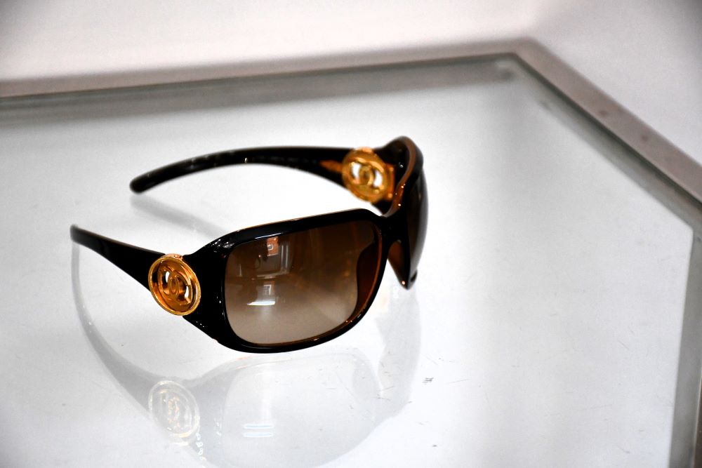 preloved Chanel Luxury Brown Sunglasses with CC gold tone logo at temples