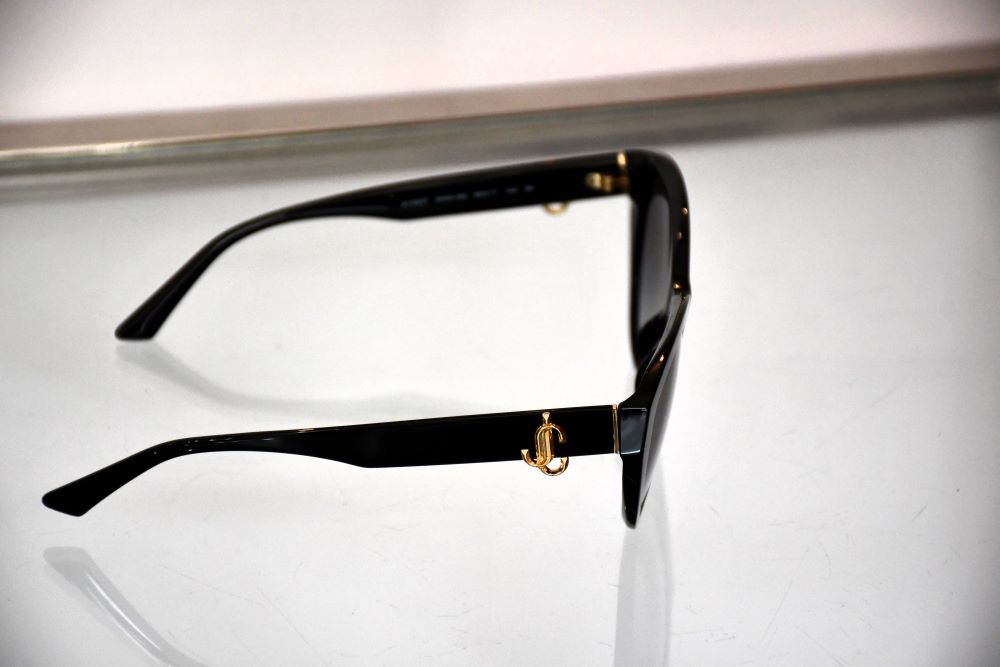 side view of preowned Jimmy Choo Black JC5007 Women's Sunglasses with JC initials