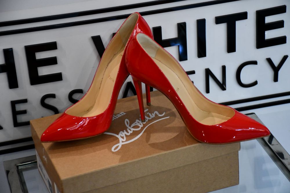 Preowned red Louboutin Pigalle Follies 100 Patent Pavot Shoes on original box