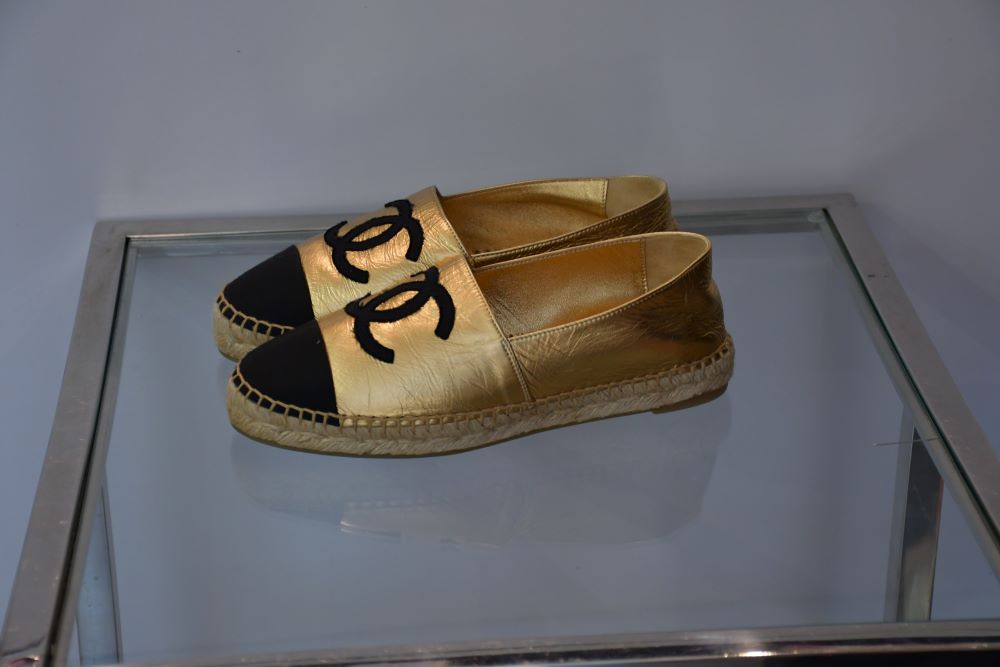 side view of pre owned Chanel CC Black Grosgrain and Gold Leather CC Espadrilles