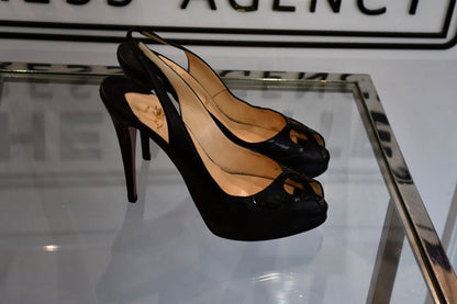 Side view of Louboutin Haute Serrine black patent 120 Shoes