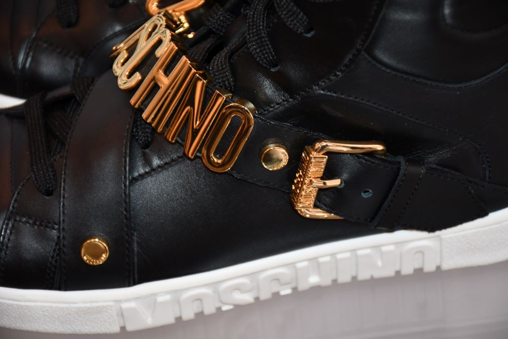 gold tone moschino high top trainers