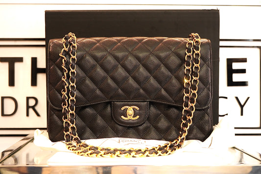 Preowned Chanel Jumbo Double Flap Bag in Black Caviar with 24K Gold Hardware