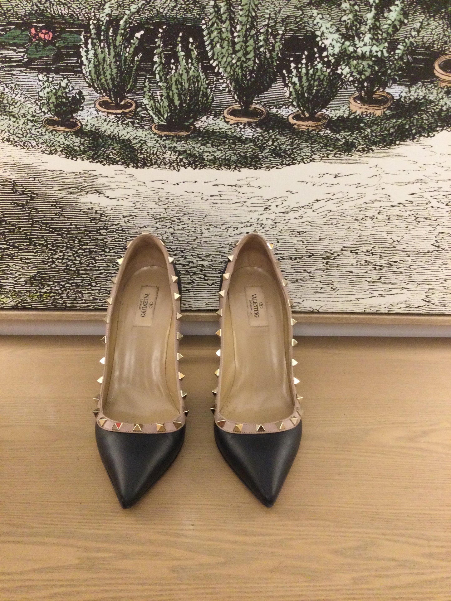 front facing preloved Valentino Rockstud black shoes with poointed toes