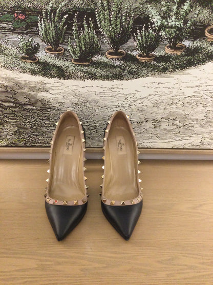 front facing preloved Valentino Rockstud black shoes with poointed toes
