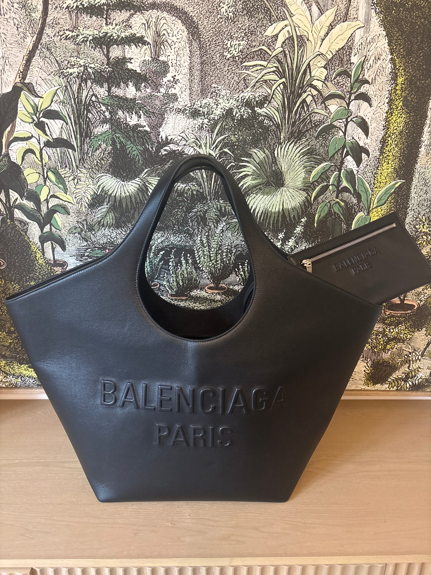 Black Balenciaga leather tote bag with embossed logo front view 