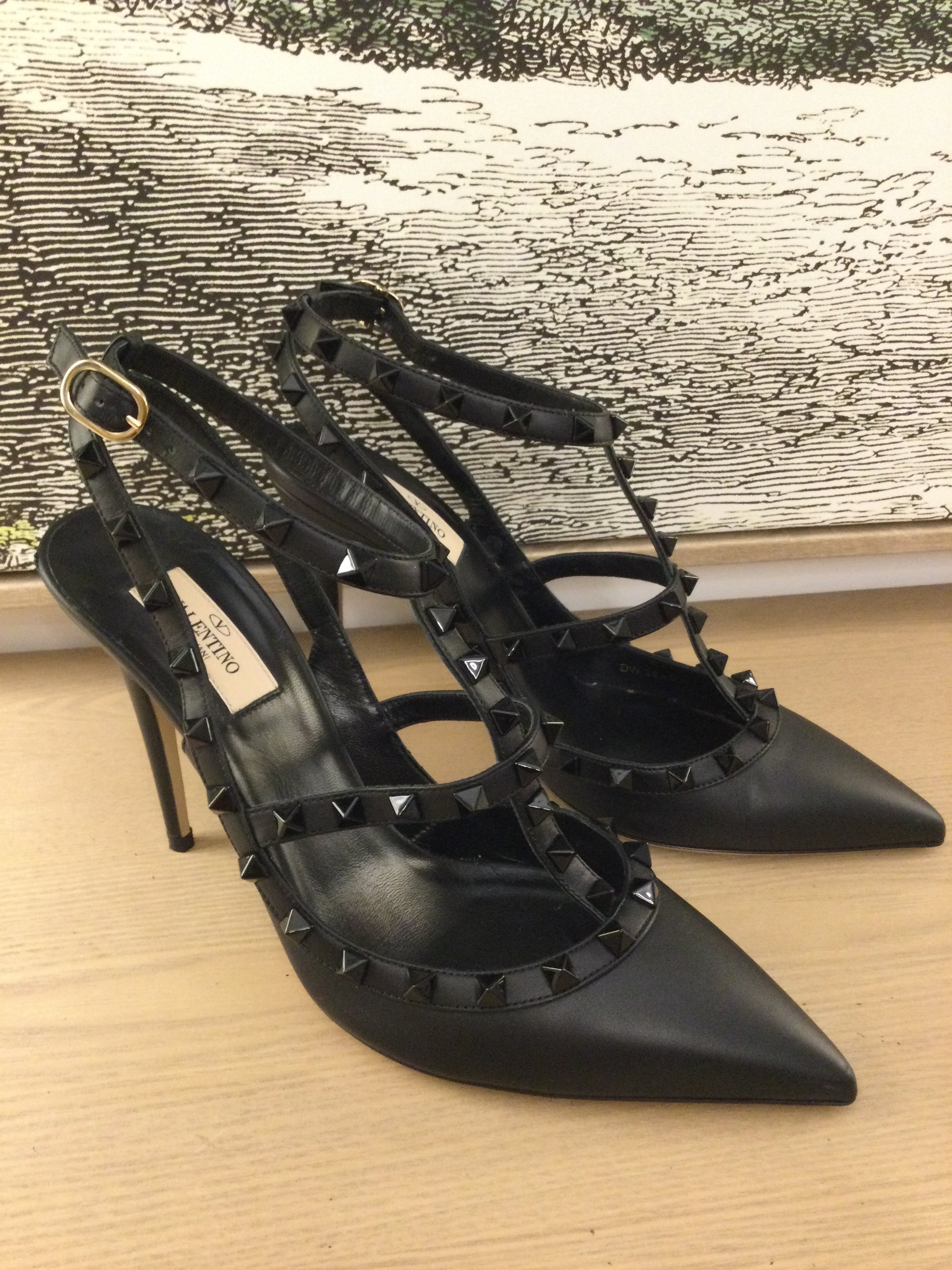 side on Valentino Garavani Rockstud black Leather heels with pointed toes
