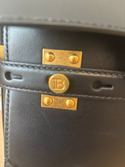 Gold tone hardware featuring Balmain plaque 