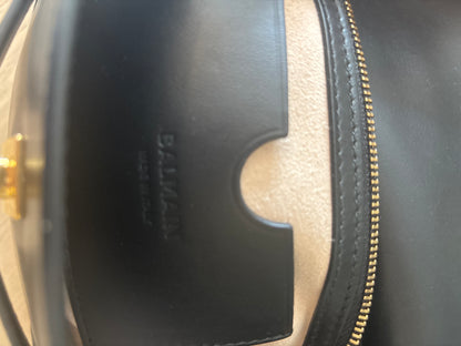 Balmain interior leather pockets showing the branded logo 