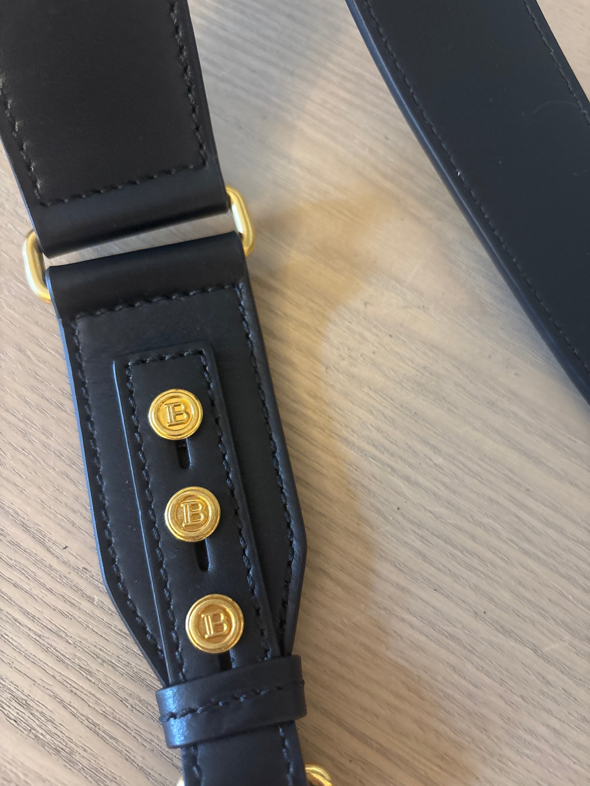 Balmain studs on the shoulder strap 
