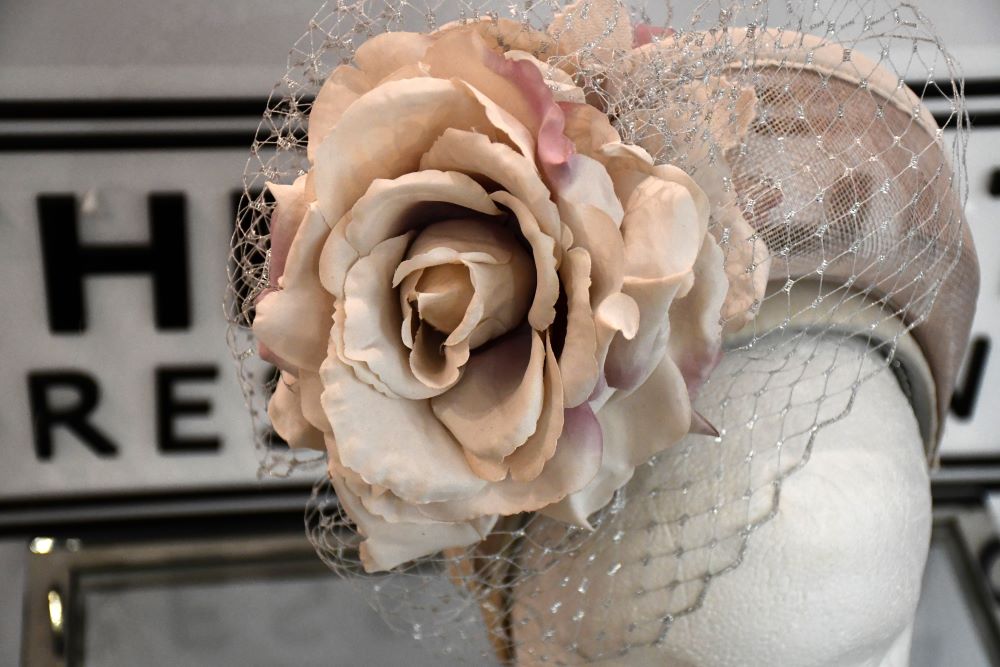 multi petalled handcrafted rose on handmade fascinator