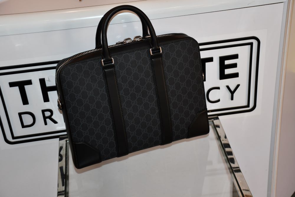 back of Gucci GG Supreme Black Briefcase leather trim