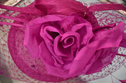 top of Snoxell Gwyther magenta rose  Fascinator