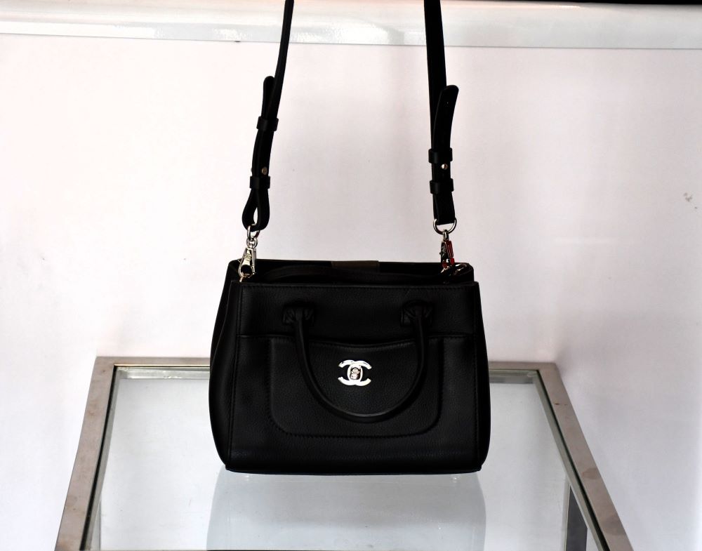 Pre owned Black Chanel handbag with a visible brand logo with shoulder strap