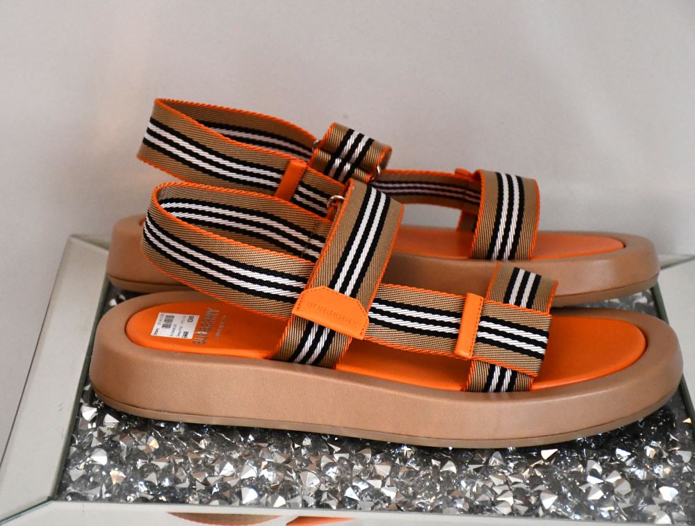 side view of preloved but never worn  Burberry Alf Sol Eve Orange Sandals