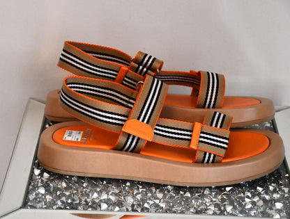 side view of preloved but never worn  Burberry Alf Sol Eve Orange Sandals