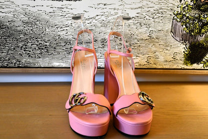 Front of Pink high-heeled Gucci Marmont leather sandals with GG gold tone buckles 