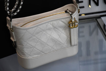 preowned cc Chanel White Gabrielle  Bag infront of box