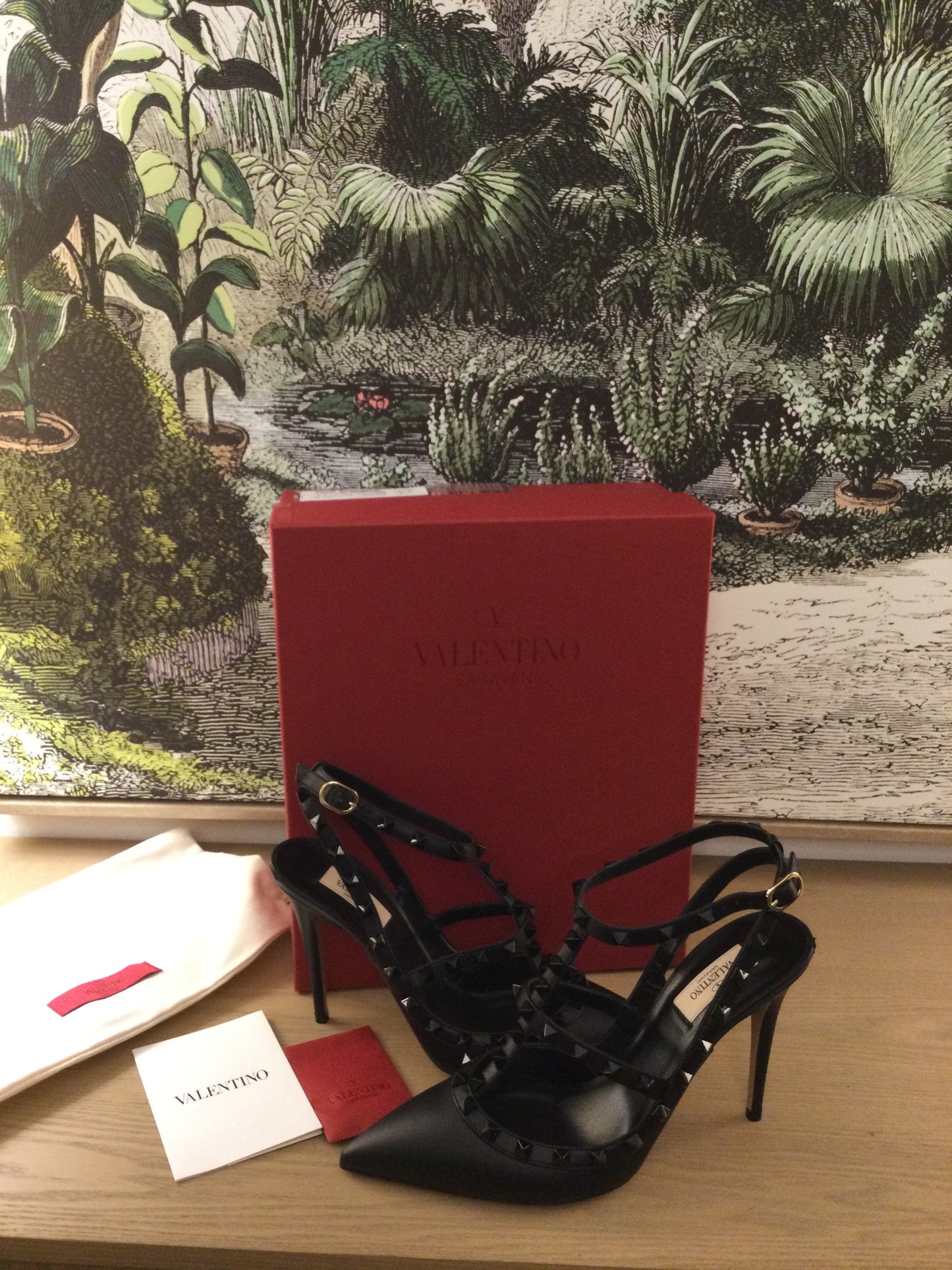 pre owned Valentino Garavani Rockstud Leather shoes infront of original red box